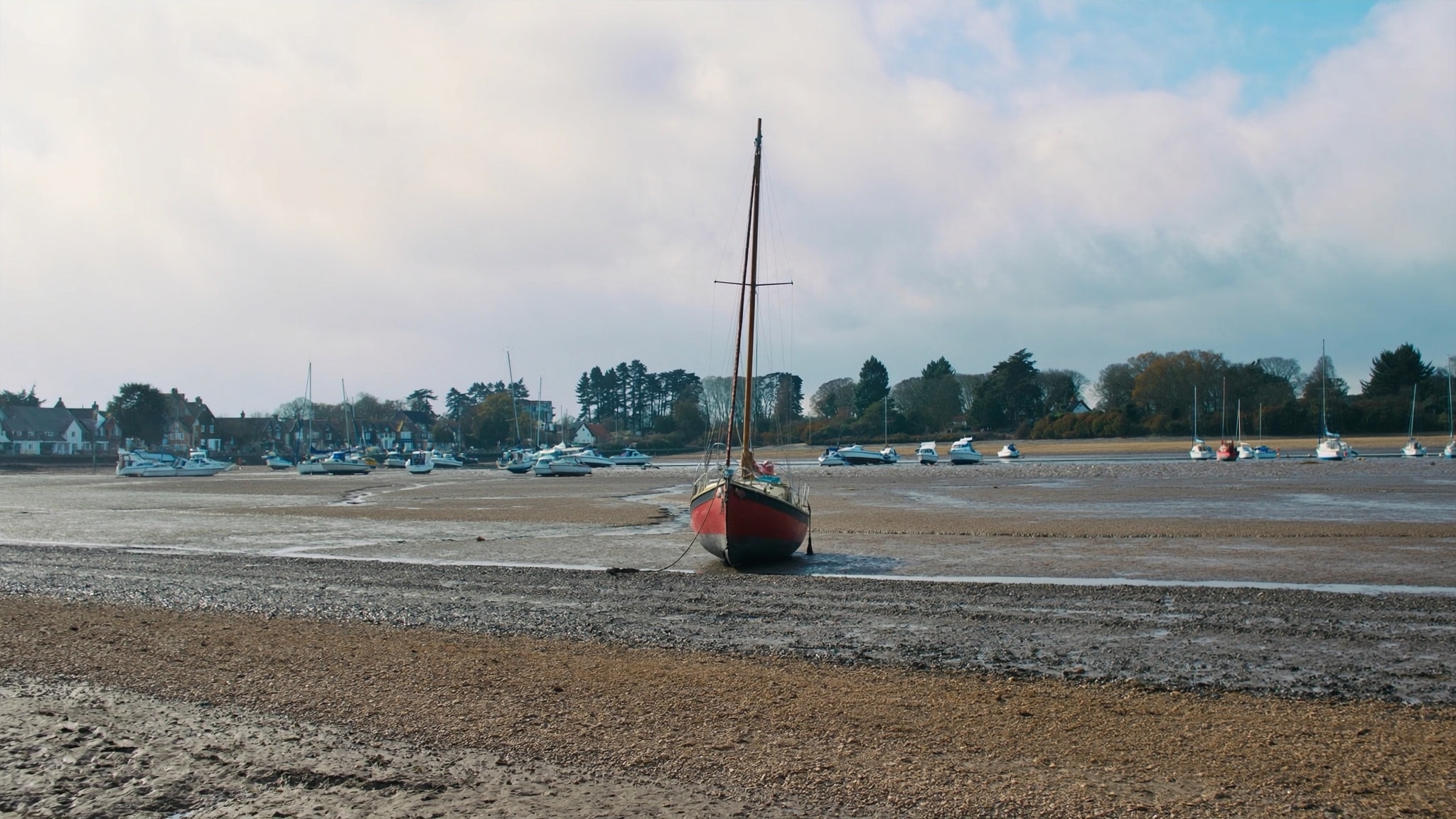 Chichester harbour at low tide with mudflats and boats